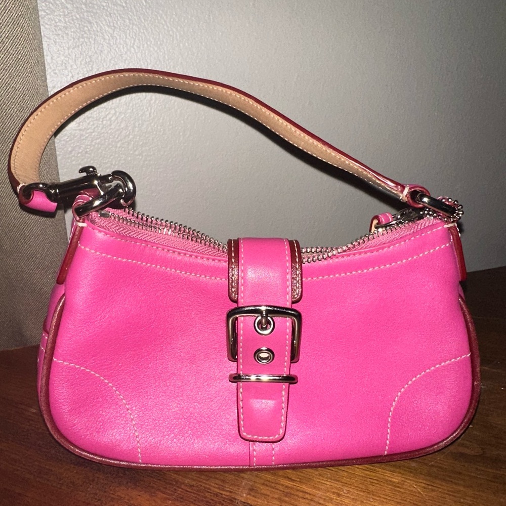 This small coach bag is in excellent condition I only carried it once.